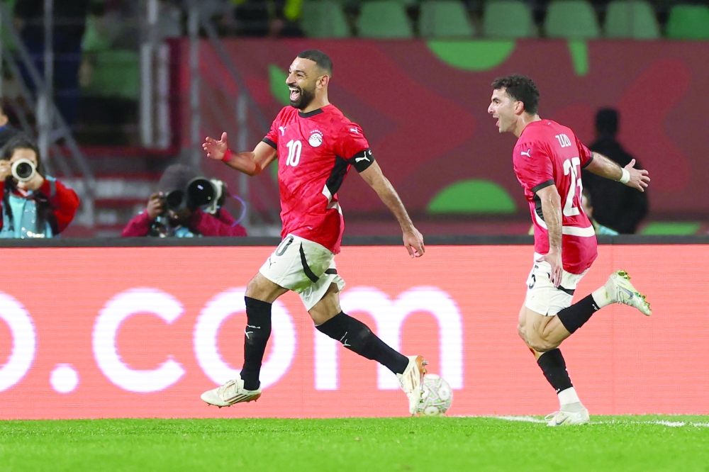 Egypt's forward #10 Mohamed Salah celebrates scoring his team's third goal during the Africa Cup of Nations (CAN) round of 16 football match between Egypt and Benin at the Grand Stadium in Agadir on January 5, 2026.   (Photo by FRANCK FIFE / AFP)
