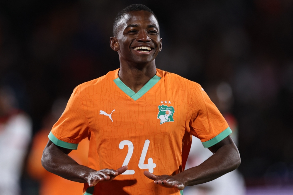 Ivory Coast's forward #24 Bazoumana Toure celebrates scoring the team's third goal 