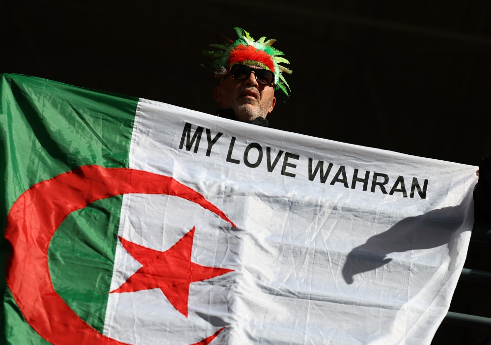  Algeria fan celebrates after the match 