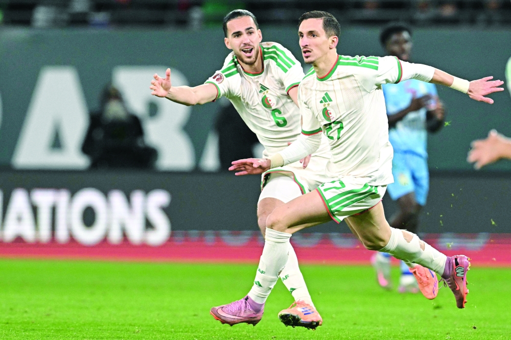 TOPSHOT - Algeria's forward #27 Adil Boulbina celebrates scoring his team's first goal during the Africa Cup of Nations (CAN) round of 16 football match between Algeria and Democratic Republic of Congo at the Prince Moulay El Hassan Stadium in Rabat on January 6, 2026.   (Photo by Gabriel BOUYS / AFP)
