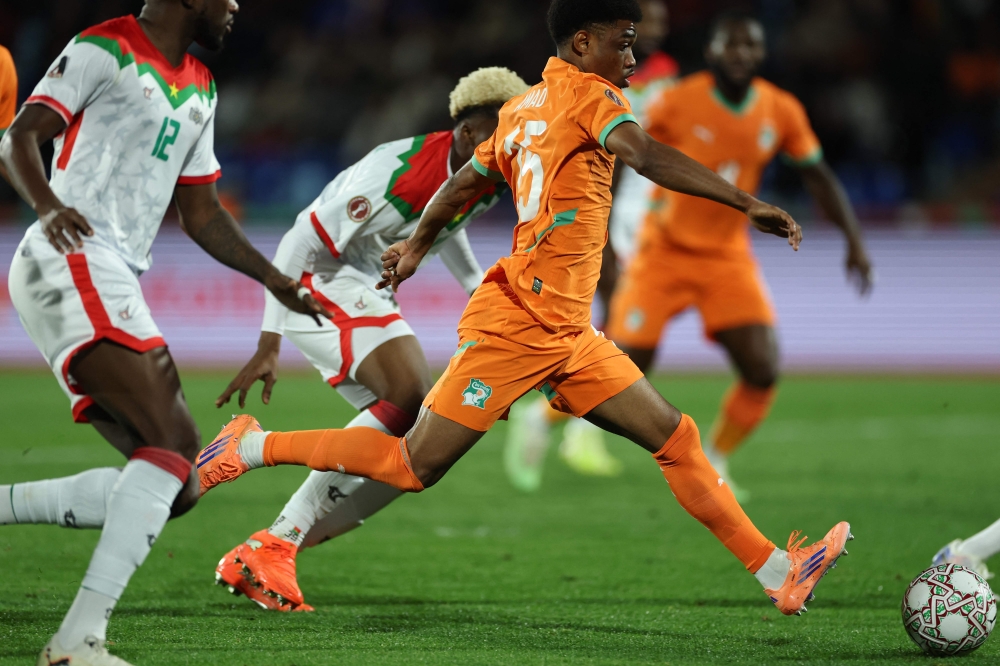 Ivory Coast's forward #15 Amad Diallo scores the team's first goal during the Africa Cup of Nations (CAN) round of 16 football match between Ivory Coast and Burkina Faso at the Grand Stadium in Marrakesh on January 6, 2026.   (Photo by FRANCK FIFE / AFP)
