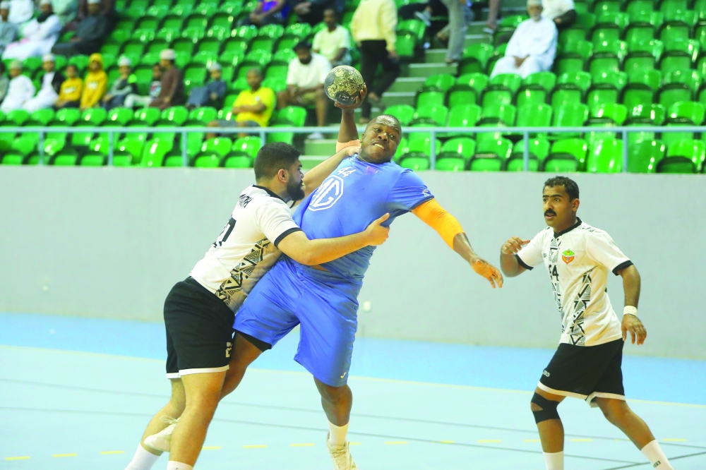 Al Amerat player Mahmoud al Jabri attempts to score a goal.