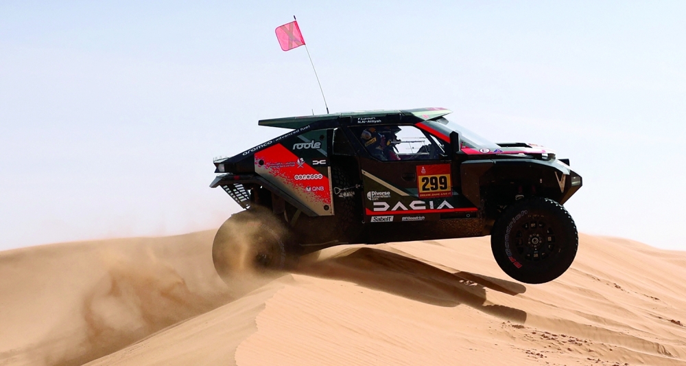 Rallying - Dakar Rally - Stage 6 - Hail to Riyadh - Hail, Saudi Arabia - January 9, 2026 Dacia's Nasser Al-Attiyah and Fabian Lurquin in action during stage 6 REUTERS/Stephane Mahe