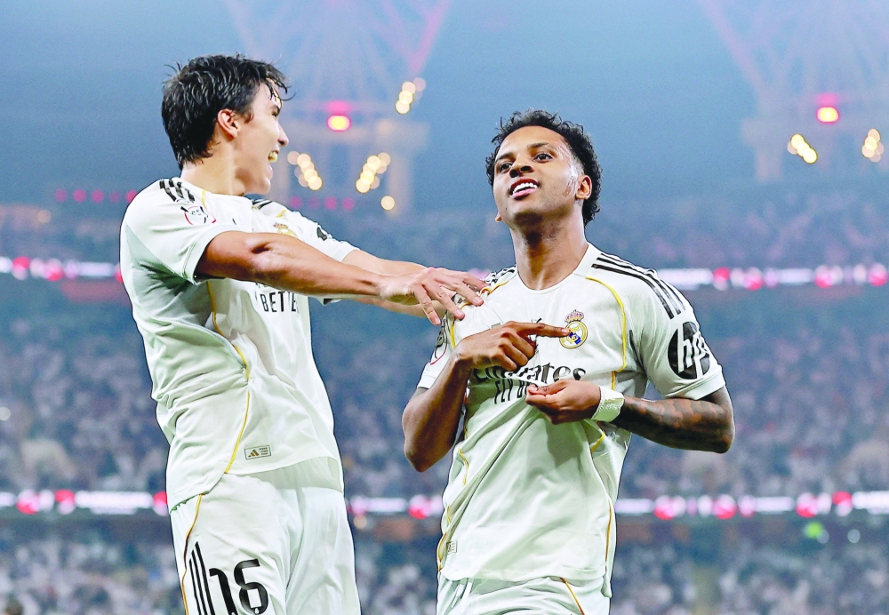 Soccer - Spanish Super Cup - Semi Final - Atletico Madrid v Real Madrid - King Abdullah Sports City, Jeddah, Saudi Arabia - January 8, 2026 Real Madrid's Rodrygo celebrates scoring their second goal with Gonzalo Garcia REUTERS