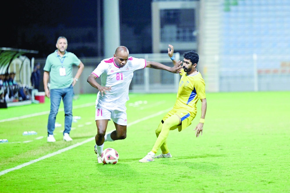 Oman Club and Bahla players in action during the Jindal League match. — Abdulwahid al Hamadani