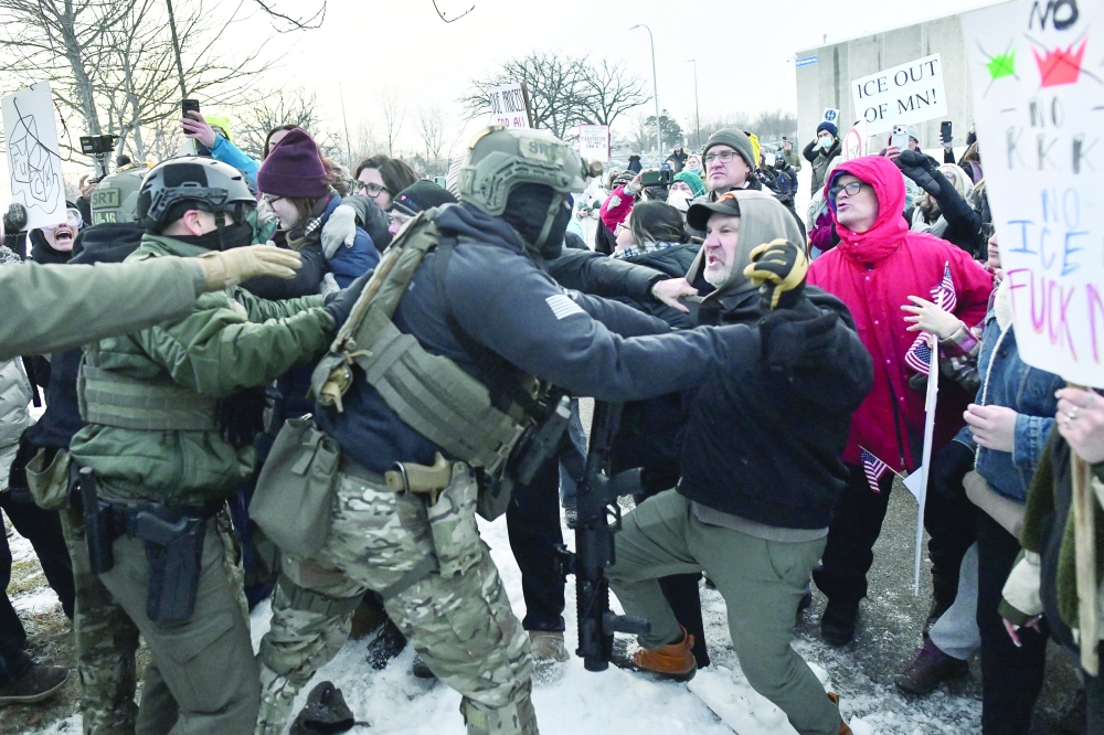 Protesters clash with federal agents outside the Bishop Henry Whipple Federal Building in Saint Paul, Minnesota. — AFP