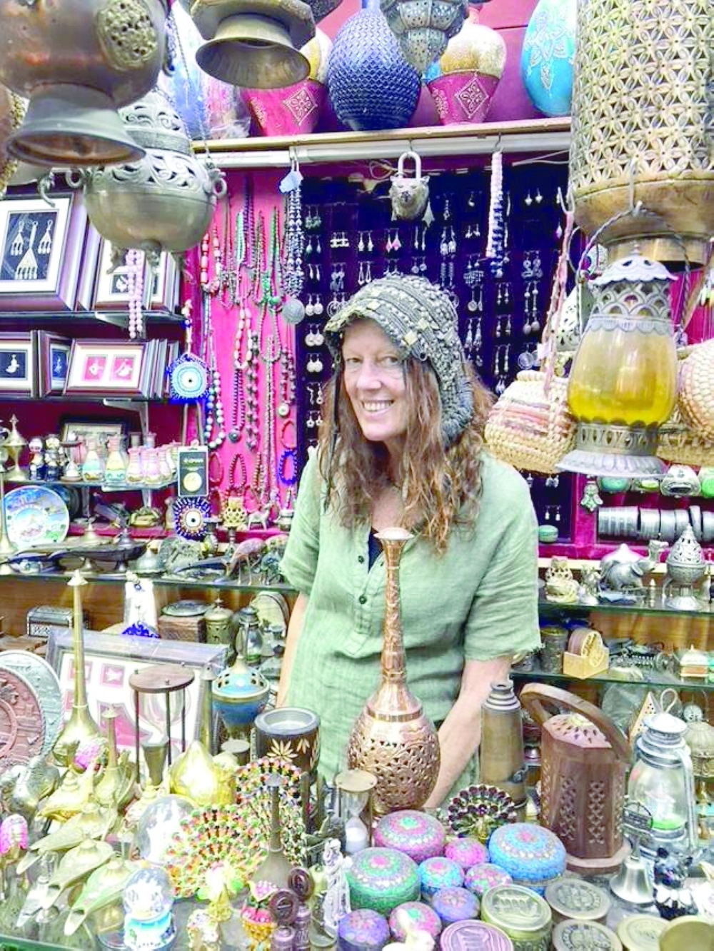 Linda Hawkins sports a Bedouin silver headdress while shopping at Muttrah Souq