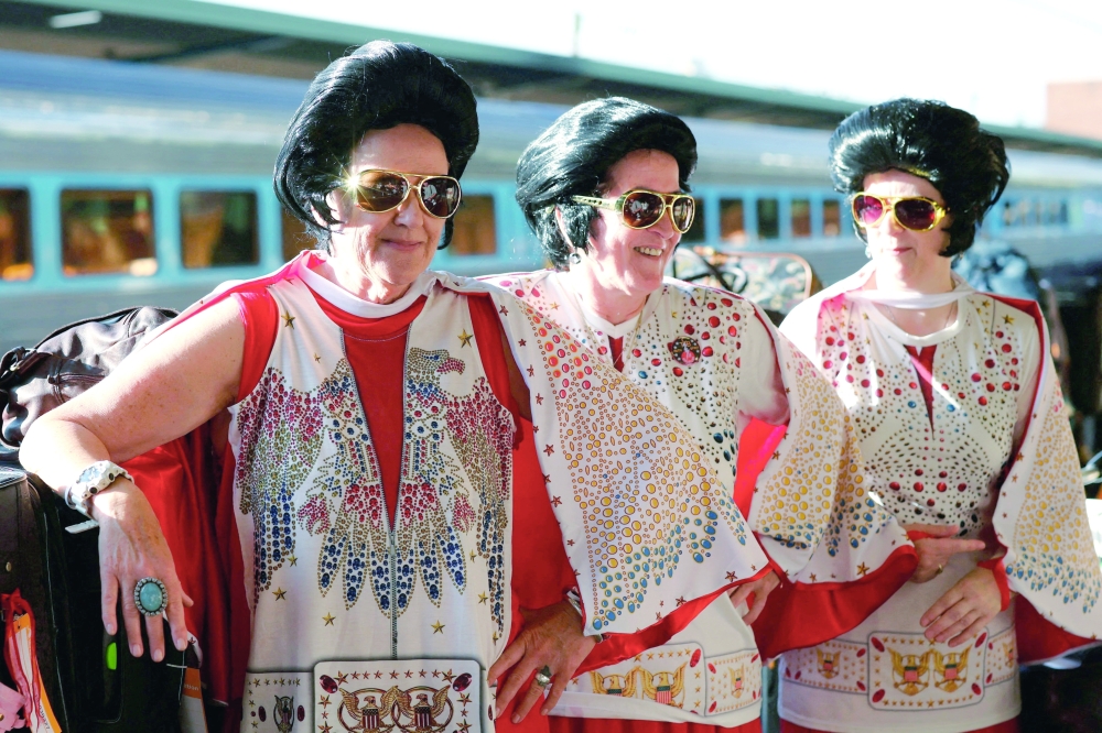 Elvis fans wait to board the Elvis Express from Sydney's Central Station, heading to the country town of Parkes for the annual Parkes Elvis Festival, in Sydney, Australia. -Reuters