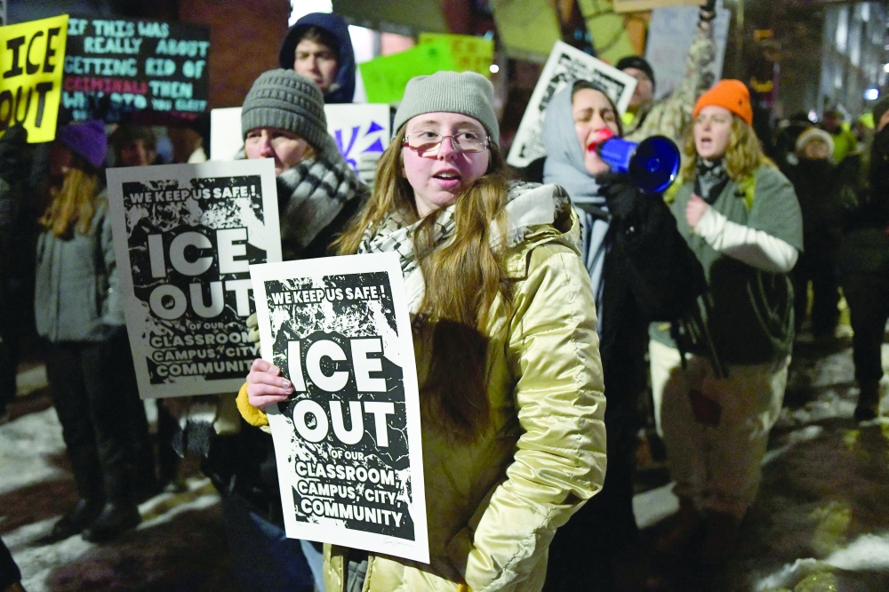 People march in protest against ICE, Minnesota. — AFP