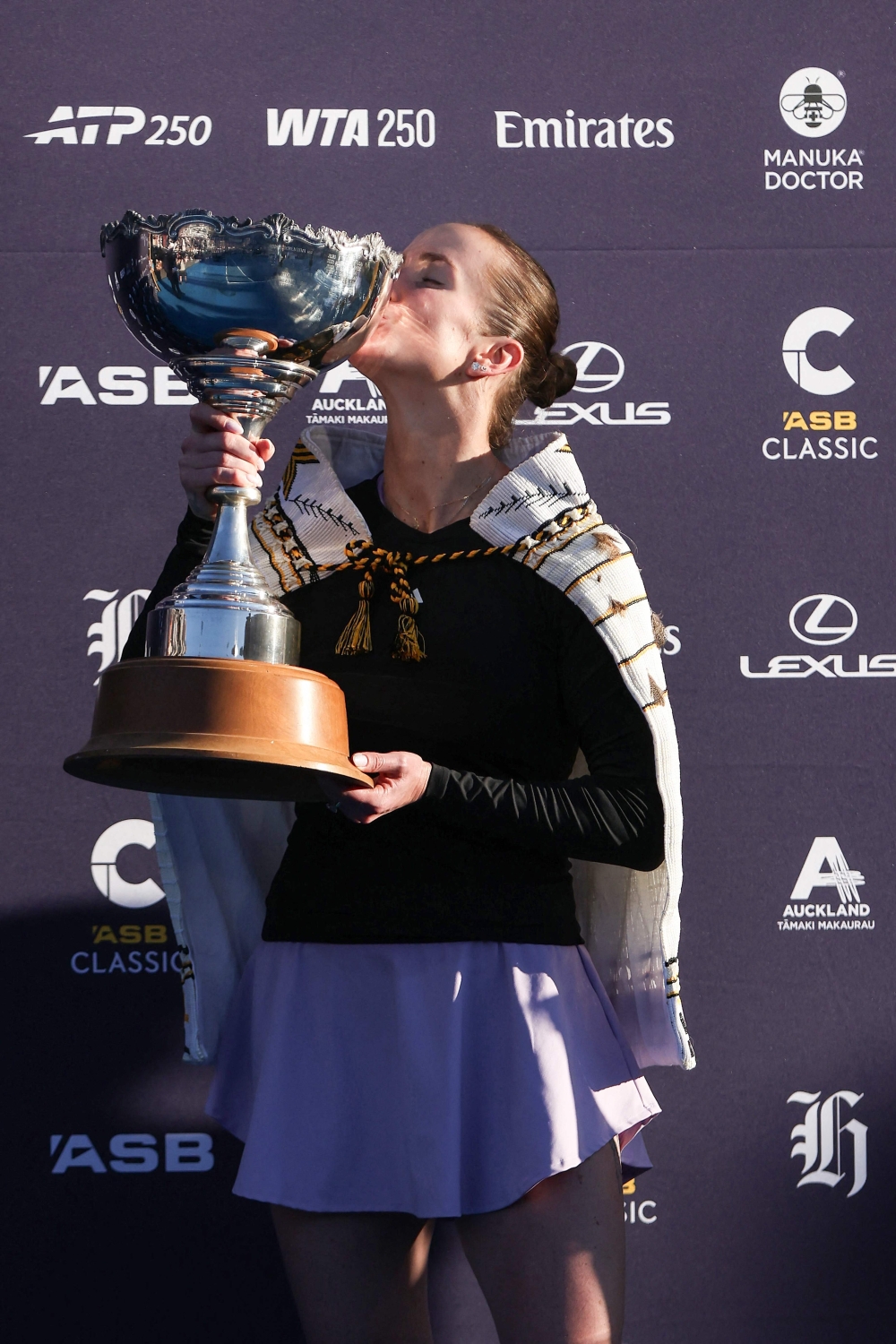 Ukraine's Elina Svitolina celebrates with the trophy after her win against China's Wang Xinyu