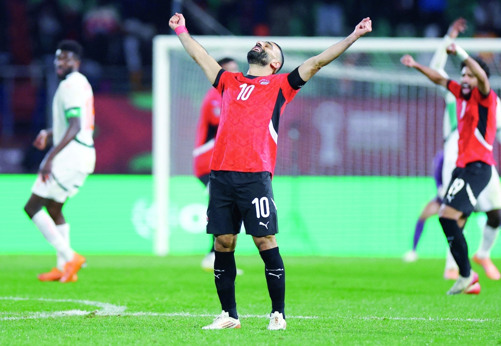 Mohamed Salah celebrates after the match. — Reuters