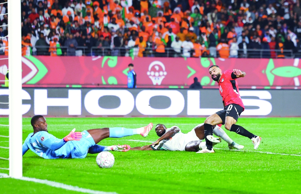 Egypt's Mohamed Salah scores their third goal. — Reuters