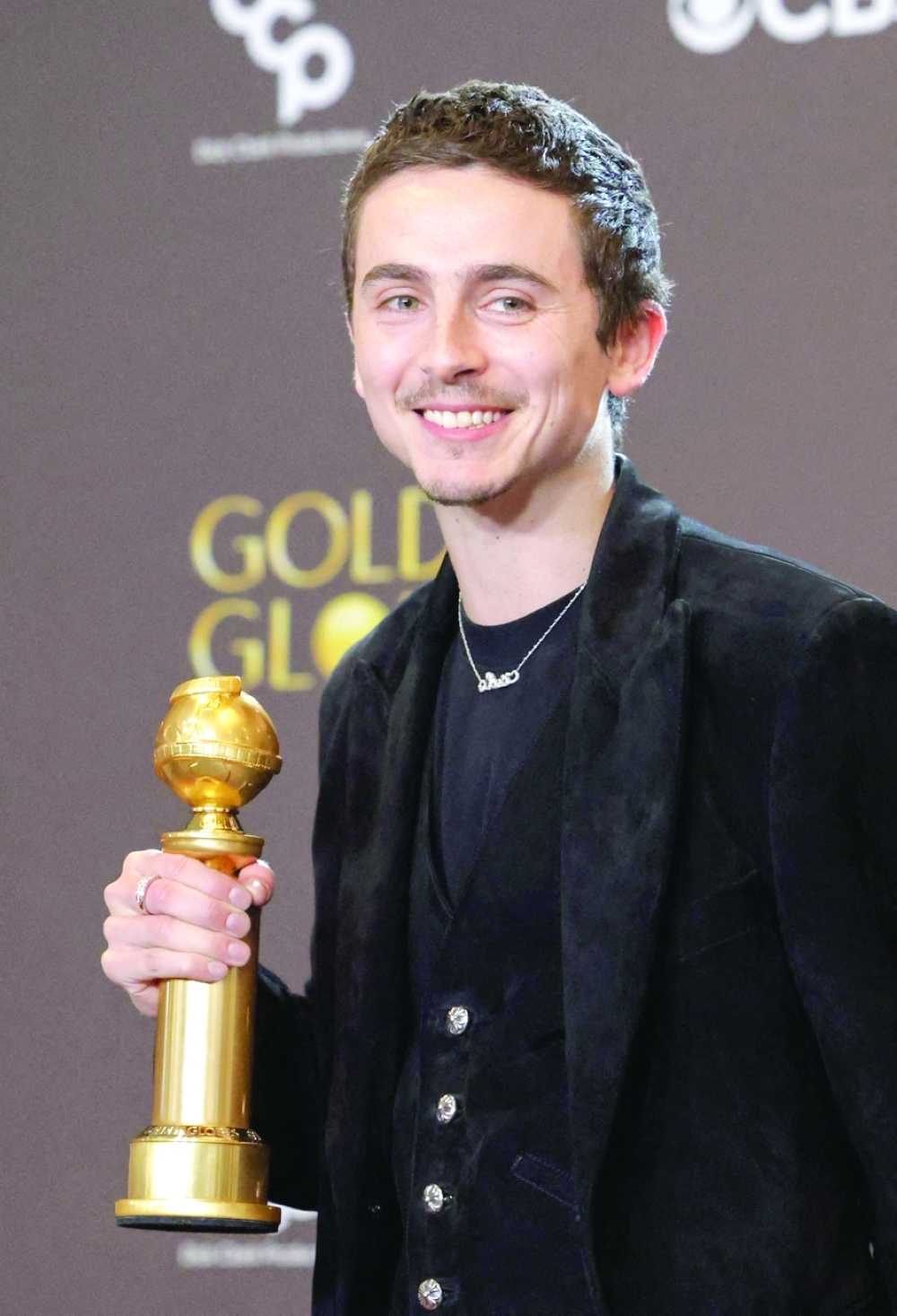 Timothee Chalamet poses with the Best Performance by a Male Actor in a Motion Picture - Musical or Comedy award for "Marty Supreme". -Reuters