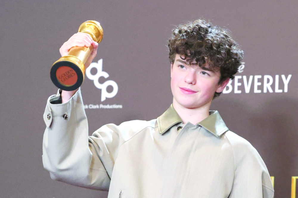 Owen Cooper poses with the Best Performance by a Male Actor in a Supporting Role on Television award for "Adolescence". -Reuters