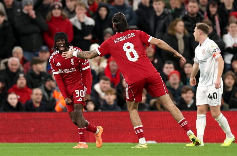  Liverpool's Jeremie Frimpong celebrates scoring their second goal with Dominik Szoboszlai 