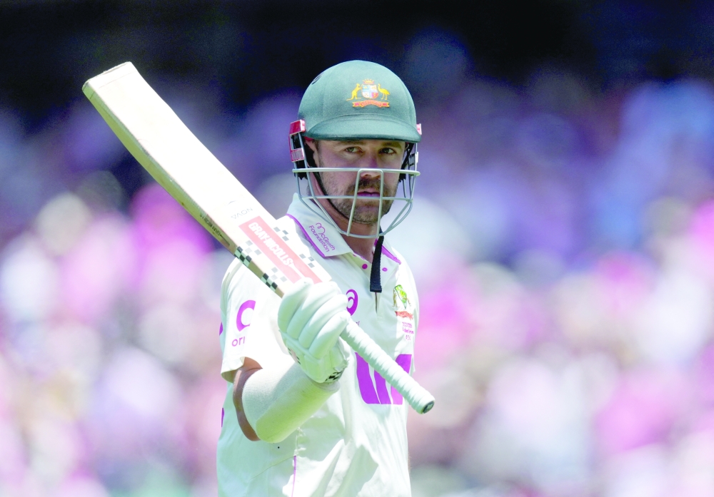 Australia's Travis Head walks back to the pavilion after losing his wicket, LBW bowled by England's Jacob Bethell. — Reuters