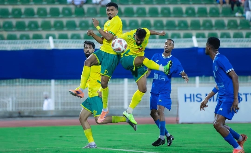 Seeb and Saham players fight for the ball.