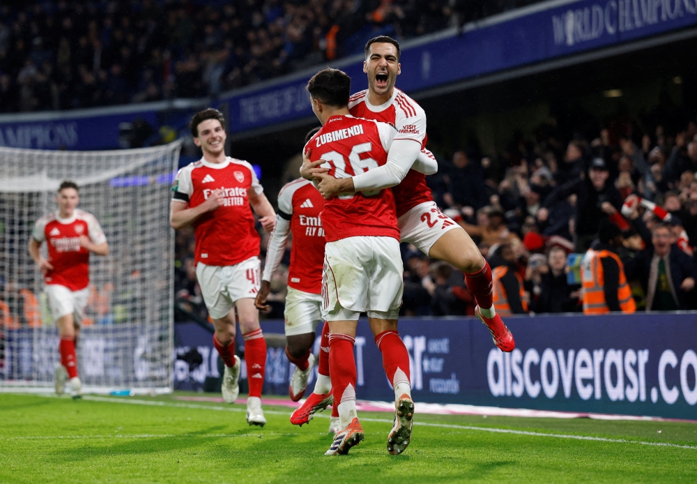  Arsenal's Martin Zubimendi celebrates scoring their third goal with Mikel Merino