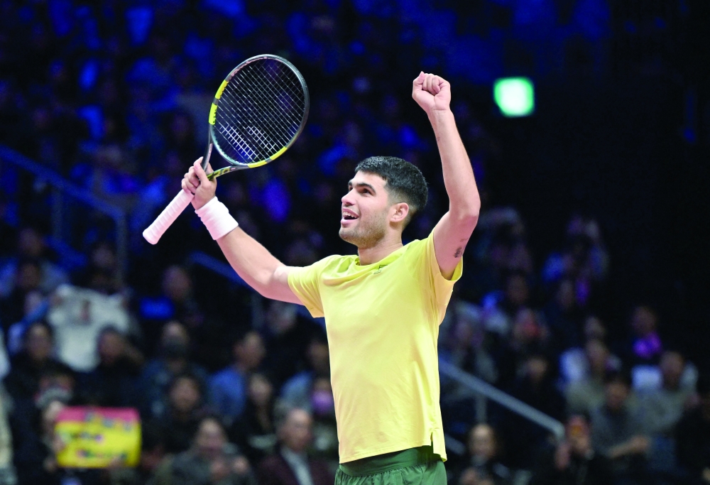 Spain's Carlos Alcaraz celebrates his victory against Italy's Jannik Sinner after their exhibition tennis match at Inspire Arena in Incheon on January 10, 2026. (Photo by Jung Yeon-je / AFP)