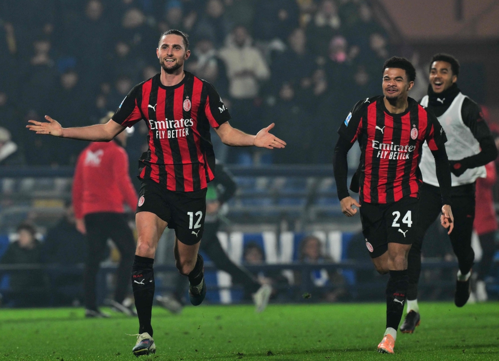 AC Milan's French midfielder #12 Adrien Rabiot celebrates scoring his team's third goal