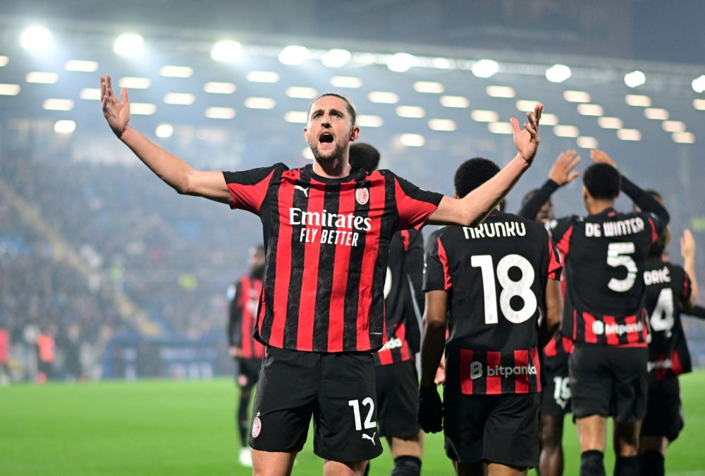 AC Milan's Adrien Rabiot celebrates scoring their second goal