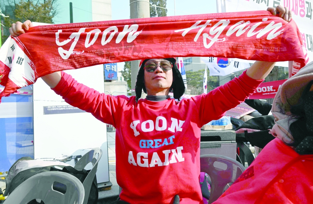Supporters of South Korea's impeached former president Yoon Suk Yeol watch a livestream of Yoon's trial in front of the Seoul Central District Court in Seoul. — AFP