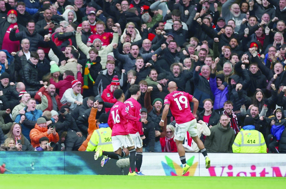 Manchester United's Bryan Mbeumo celebrates scoring their first goal with Bruno Fernandes and Amad Diallo. — Reuters