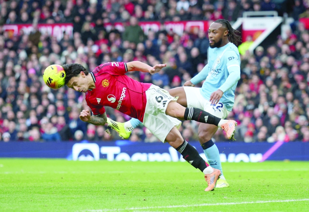 Manchester United's Lisandro Martinez in action with Manchester City's Antoine Semenyo. — Reuters