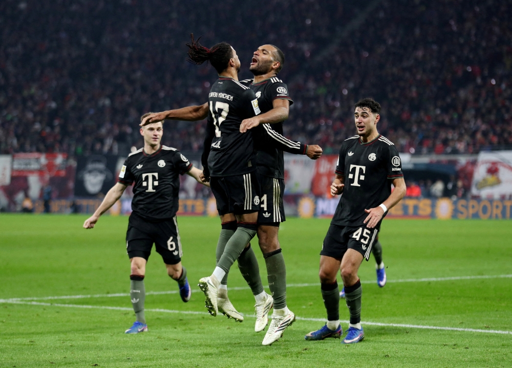  Bayern Munich's Jonathan Tah celebrates scoring their third goal 