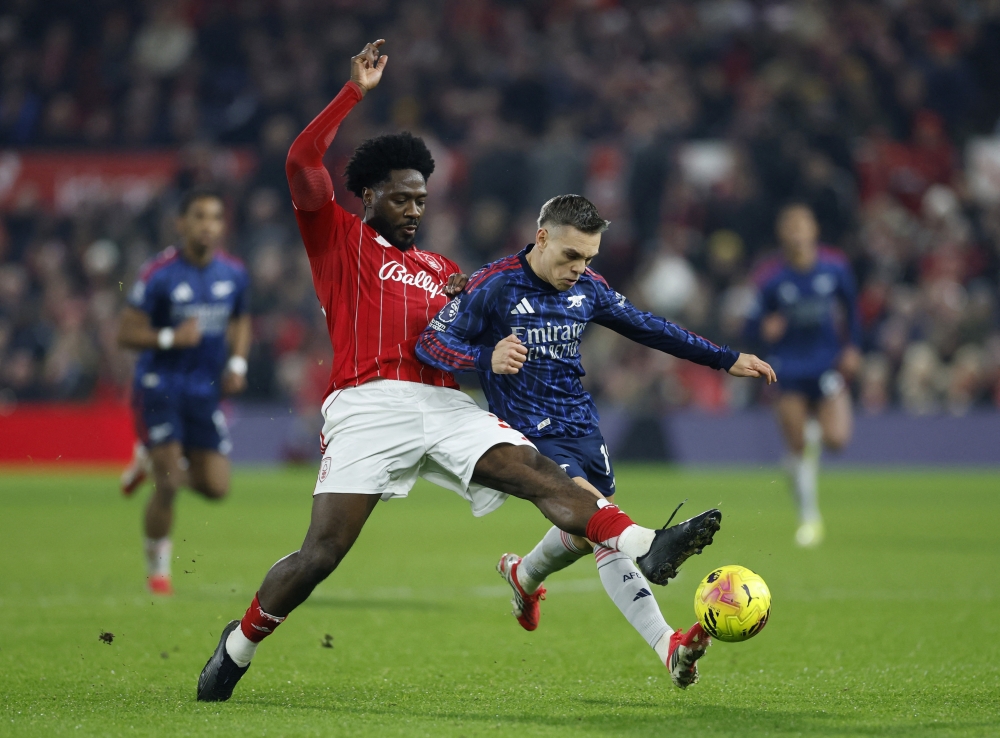  Nottingham Forest's Ola Aina in action with Arsenal's Leandro Trossard 