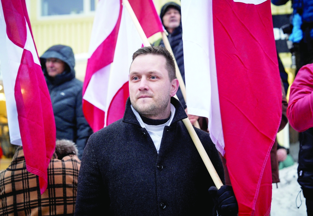 Greenlandic PM Jens-Frederik Nielsen takes part in a demonstration, in Nuuk. — AFP