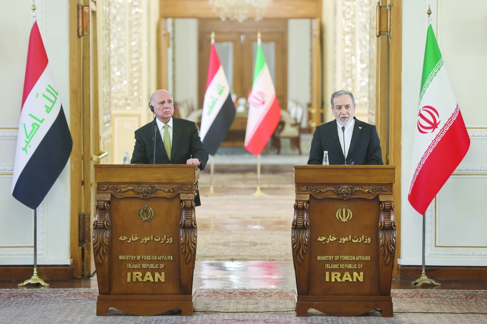 Iranian FM Abbas Araghchi attends a press conference with Iraqi FM Fuad Hussein in Tehran. — Reuters