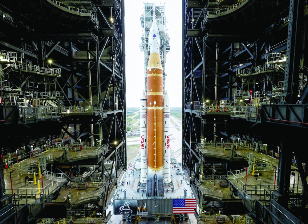 
Nasa’s next-generation moon rocket, the SLS rocket with the Orion crew capsule, rolls from the Vehicle Assembly Building to the launch pad at the Kennedy Space Centre in Cape Canaveral, Florida, on Sunday. — Reuters 