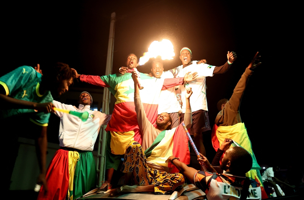  Senegal fans celebrate after the  winning 