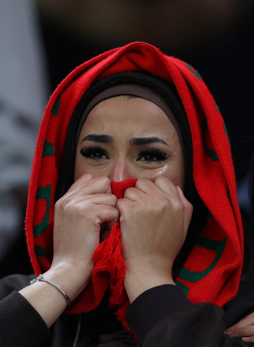   A Morocco fan looks dejected after the match 