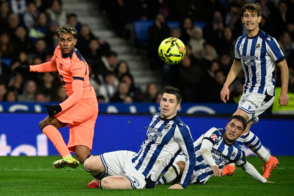 (From L)  Lamine Yamal, Real Sociedad's  Zubeldia,  Gorrotxategi and  Aihen Munoz look at the ball  