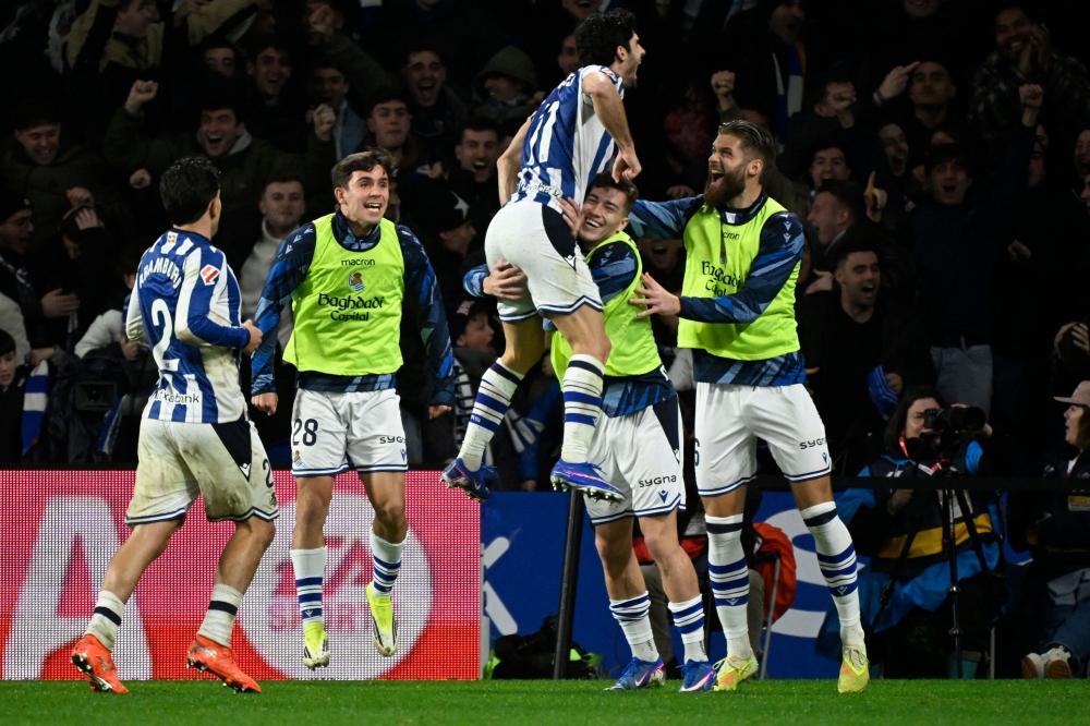 Real Sociedad's Portuguese forward #11 Goncalo Guedes (C) celebrates scoring his team's second goal  