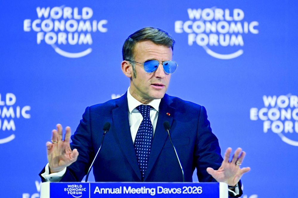 
France’s President Emmanuel Macron speaks at WEF in Davos on Tuesday. — AFP 