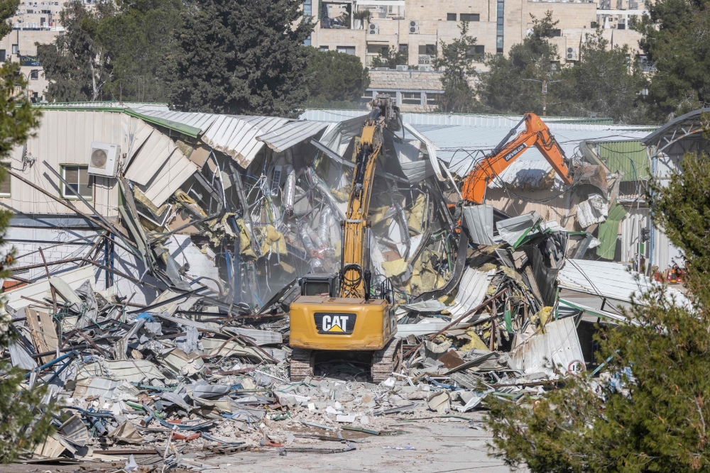 
A structure being demolished inside the headquarters of the United Nations Relief and Works Agency (UNRWA) in the Sheikh Jarrah neighbourhood of Israeli-annexed east Jerusalem on Tuesday. — AFP 