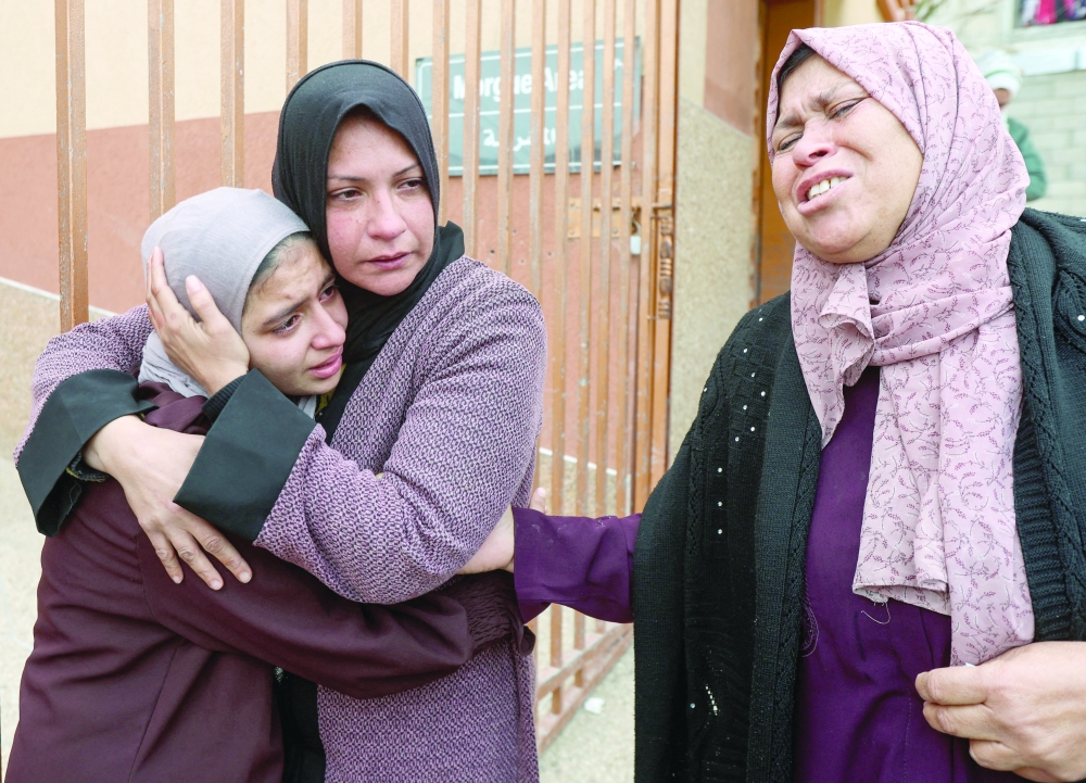Mourners react during the funeral of Palestinians who were killed by Israeli strikes in Khan Yunis on Wednesday. — AFP