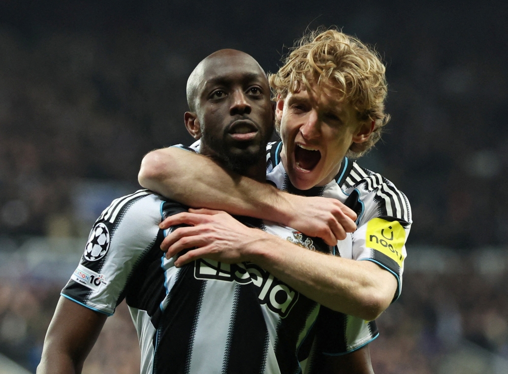 Newcastle United's Yoane Wissa celebrates scoring their first goal with Anthony Gordon 