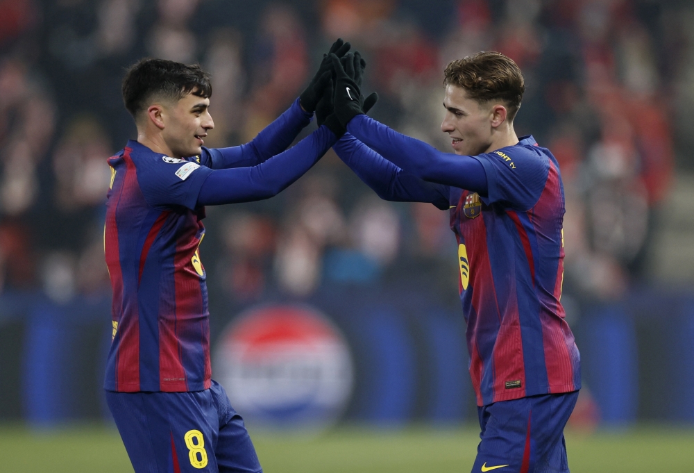FC Barcelona's Fermin Lopez celebrates scoring their second goal with FC Barcelona's Pedri 