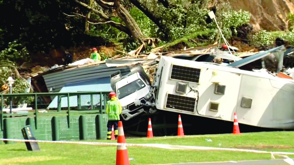 Damaged caravans and vehicles remain stuck amid rubble, in the aftermath of a landslide at a campsite triggered by heavy rains, in Mount Maunganui, New Zealand. - Reuters