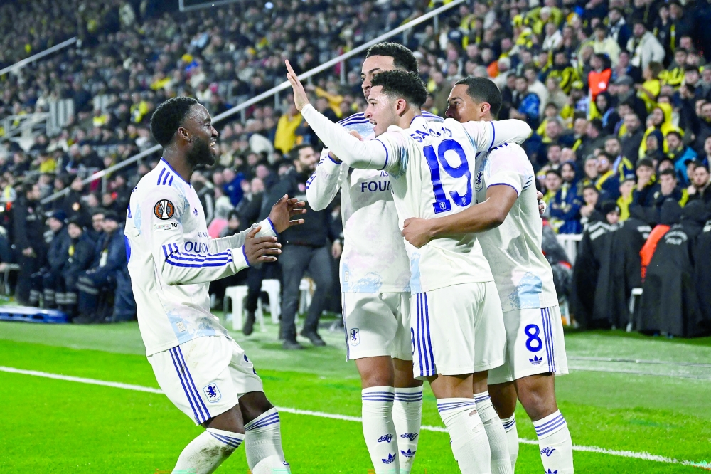 Aston Villa's  English defender #19 Jadon Sancho celebrates with teammates after scoring team's first goal during the UEFA Europa League 7 round day football match between Aston villa and Fenerbahce at the Chobani Stadium, Istanbul, on January 22, 2026. (Photo by Yasin AKGUL / AFP)
