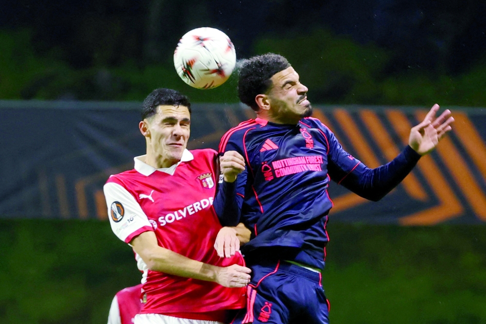 Soccer Football - UEFA Europa League - S.C. Braga v Nottingham Forest - Estadio Municipal de Braga, Braga, Portugal - January 22, 2026 Nottingham Forest's Morgan Gibbs-White in action with S.C. Braga's Diego Rodrigues REUTERS/Rita Franca