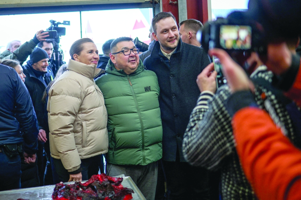 Denmark's Prime Minister Mette Frederiksen and Greenland's Prime Minister Jens-Frederik Nielsen pose in Nuuk, Greenland. — Reuters