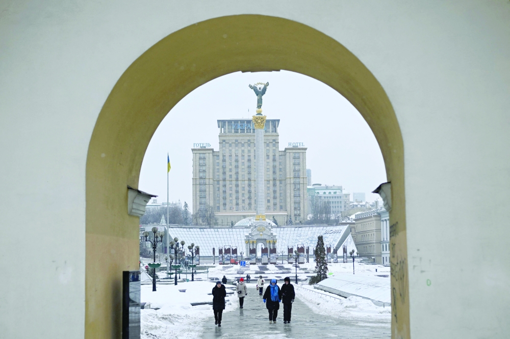 Pedestrians walk across Independence Square in Kyiv amidst the Russian war in Ukraine. — AFP