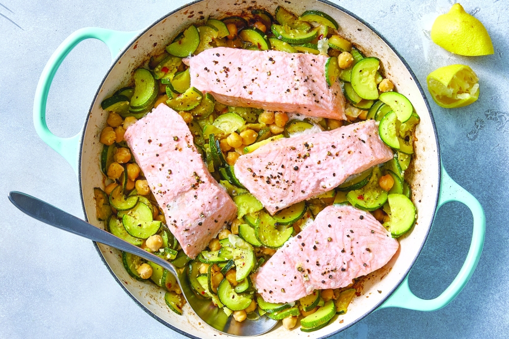 Salmon with olive oil-braised zucchini and chickpeas. Slow-cooking zucchini in garlicky olive oil intensifies their natural sweetness and gives them a silky texture