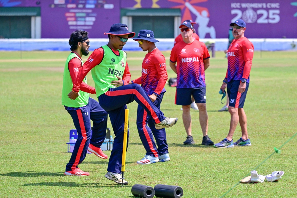 Nepal's captain Rohit Paudel (2nd L) and teammates take part in a practice session 