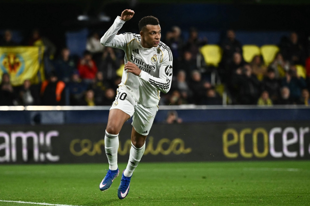 Real Madrid's French forward #10 Kylian Mbappe celebrates after scoring his team's second goal 